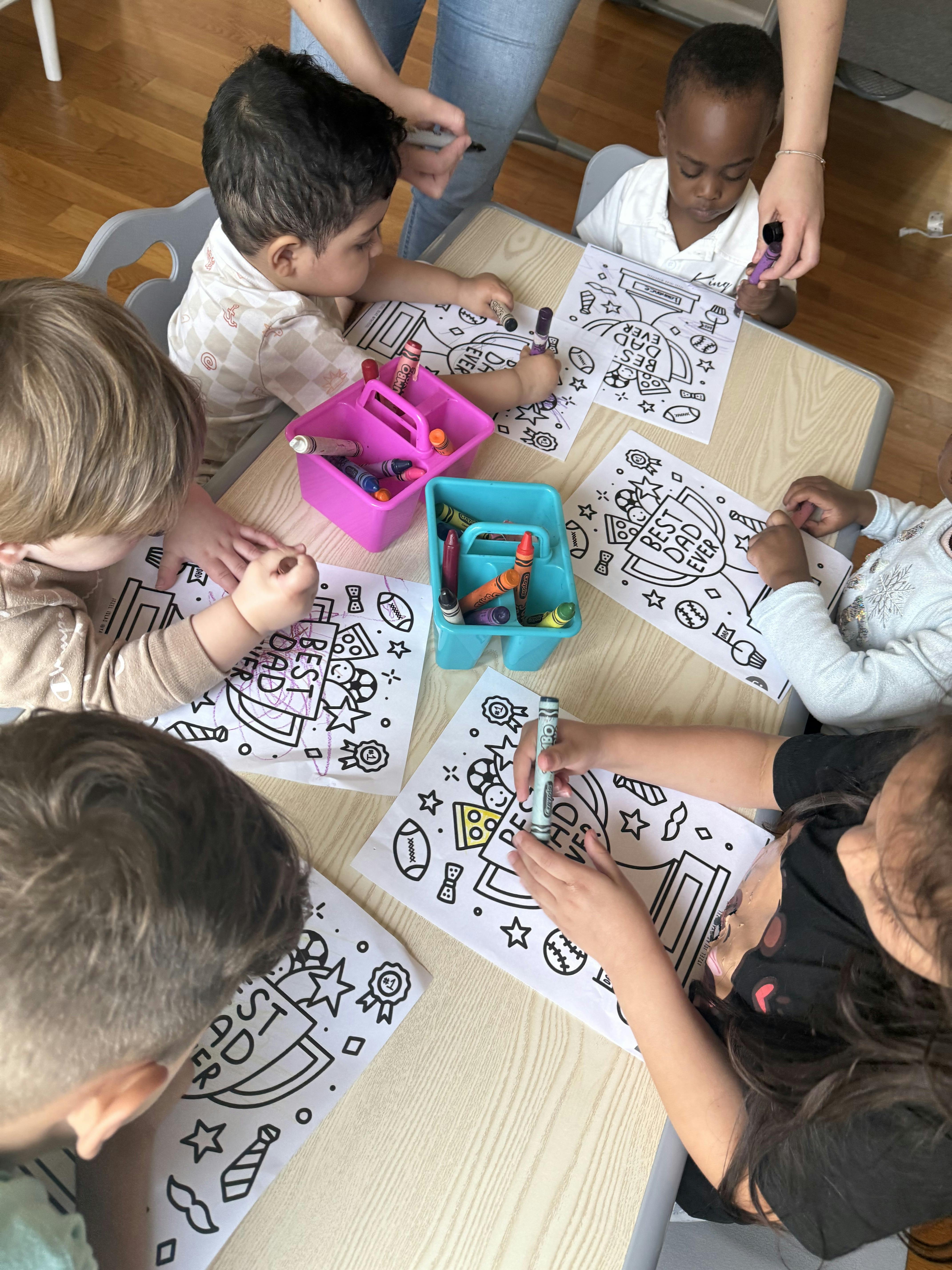 Children coloring at a table