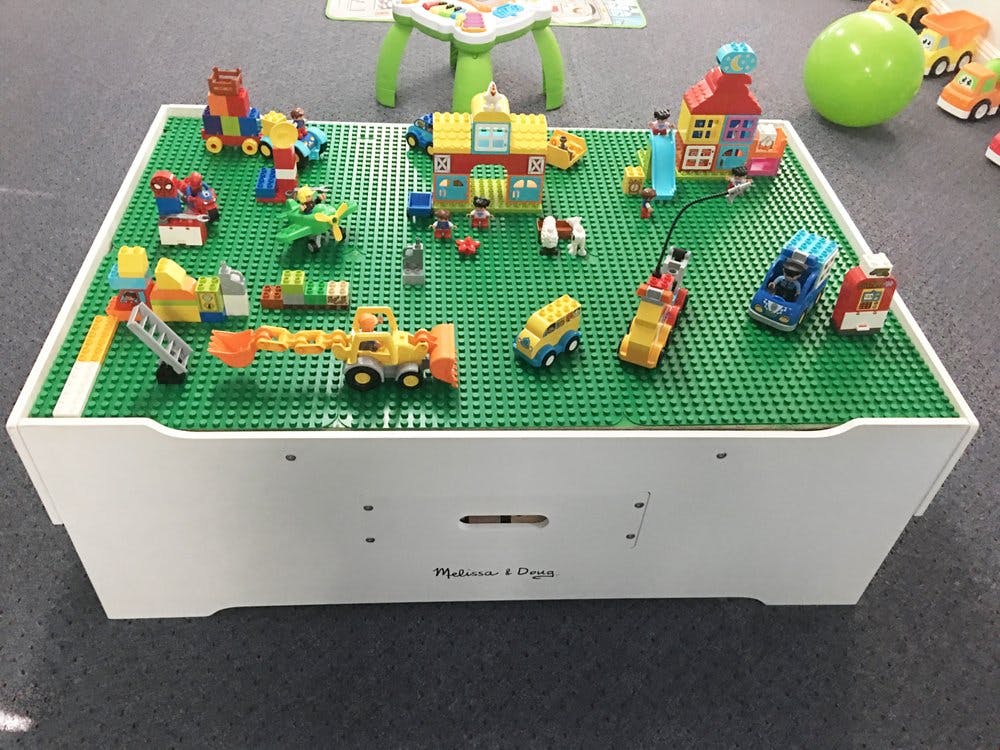 Building block table with various colorful block creations