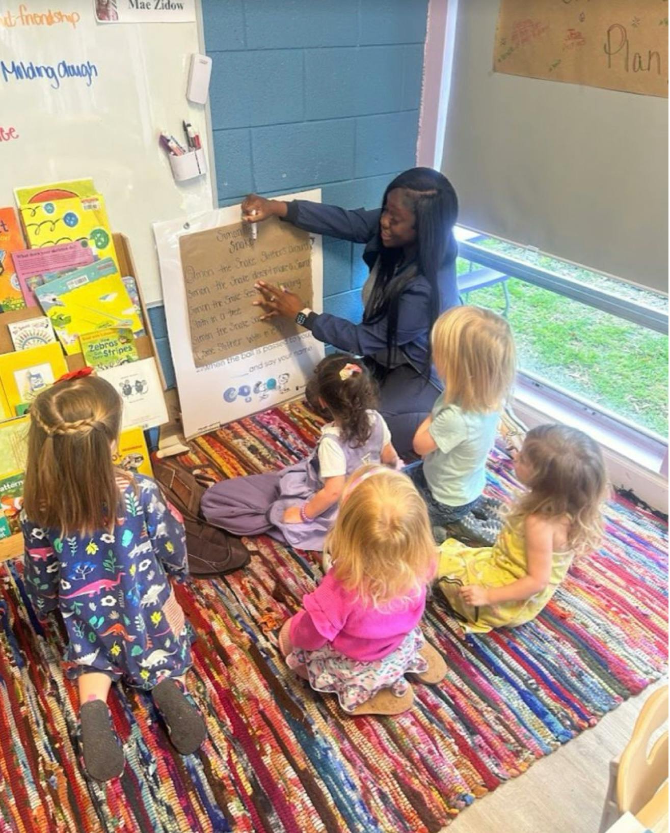 Person teaching children in a classroom