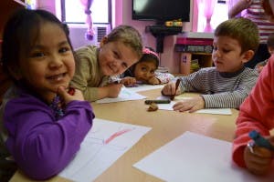 Children drawing at a table
