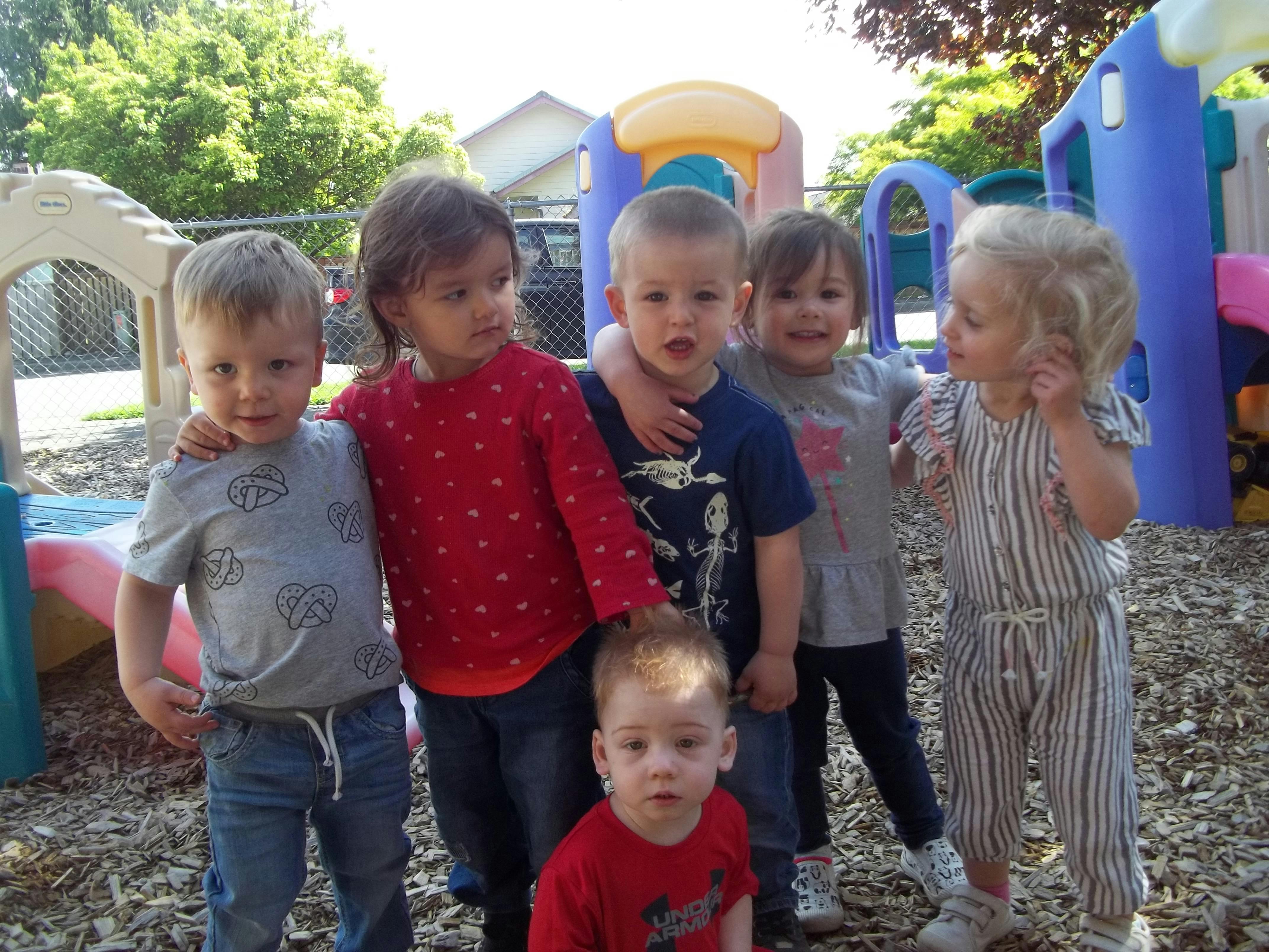 Group of children standing together on a playground