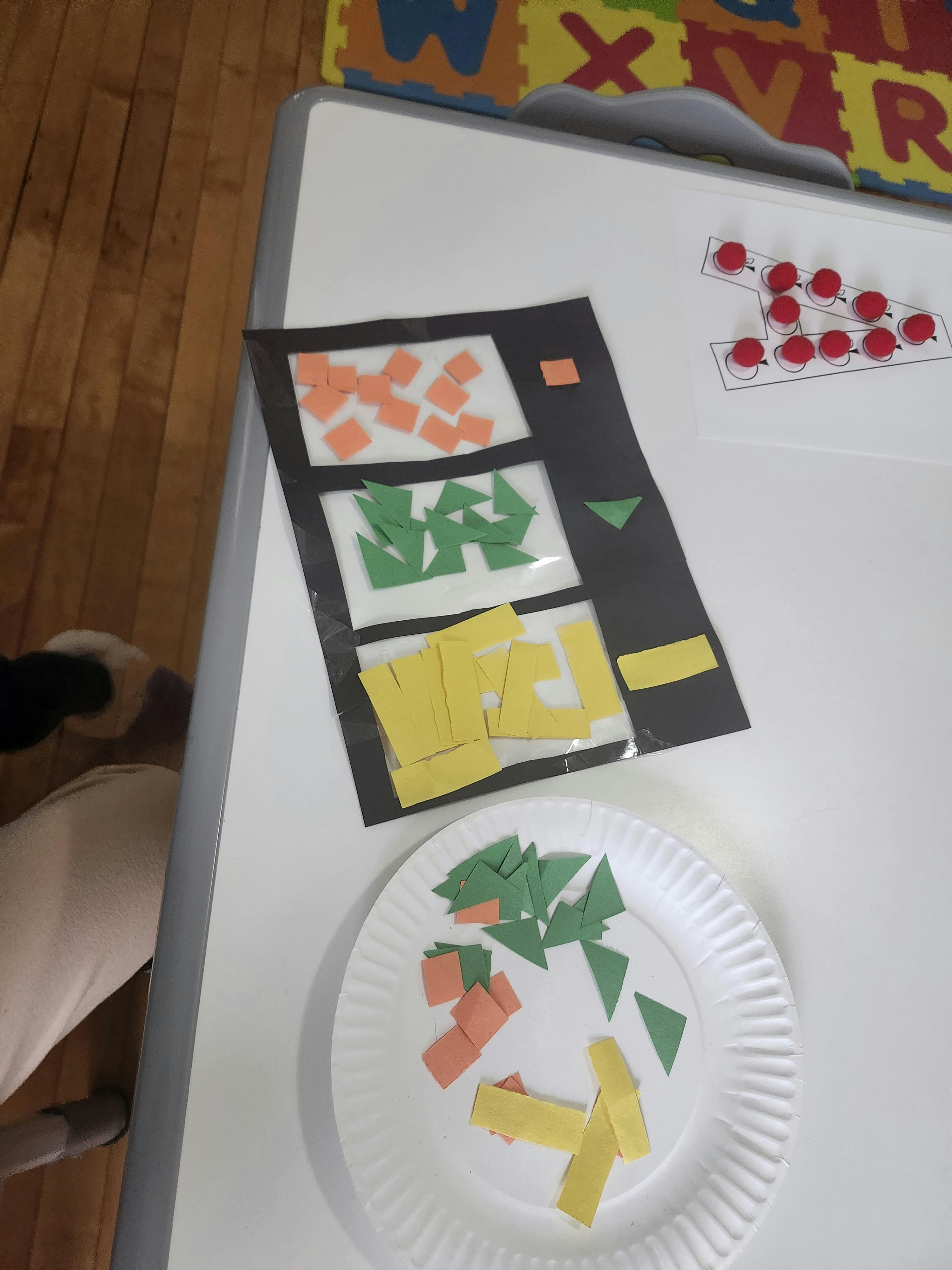 Craft activity with paper shapes and a large letter A
