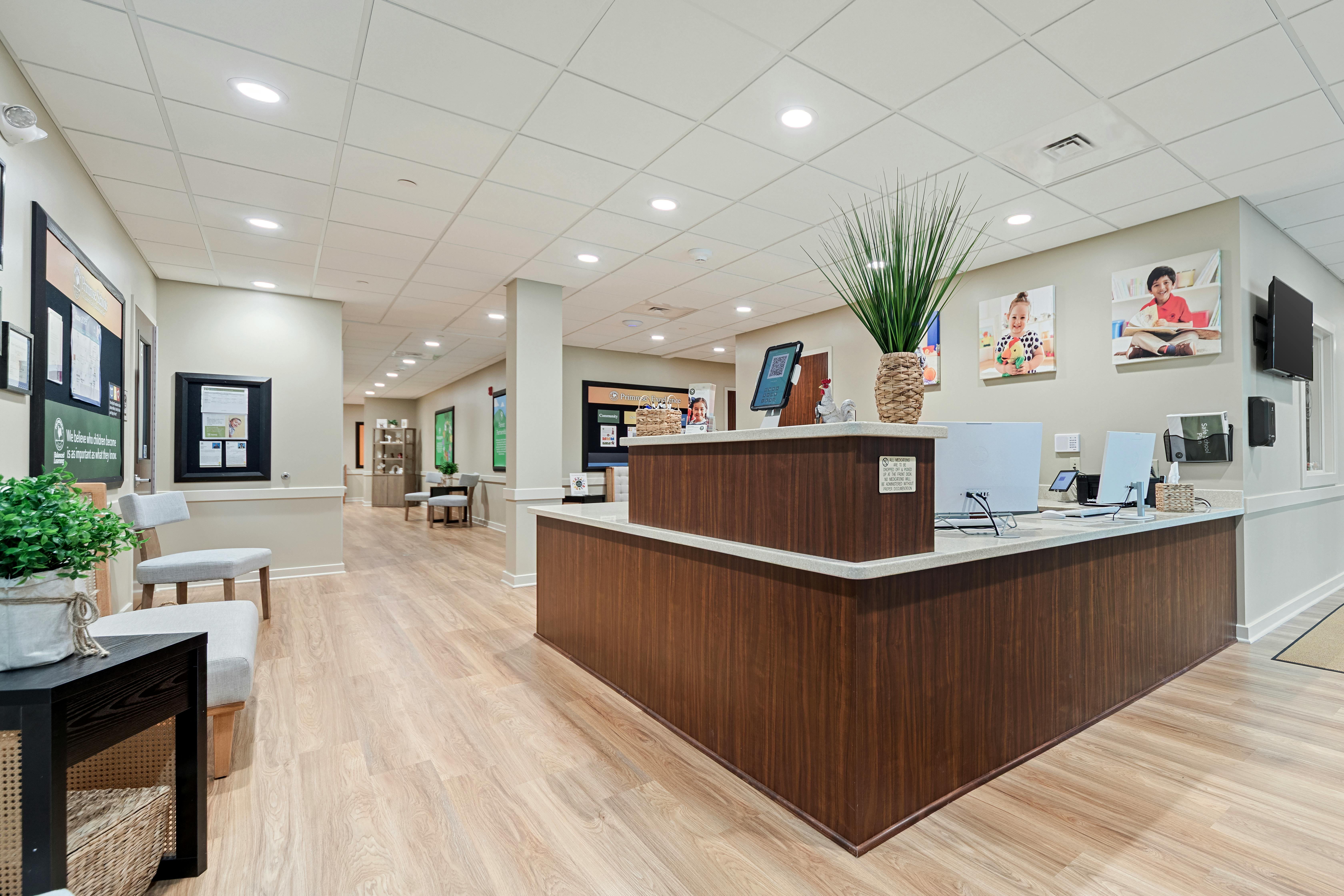 An empty reception desk in a brightly lit office