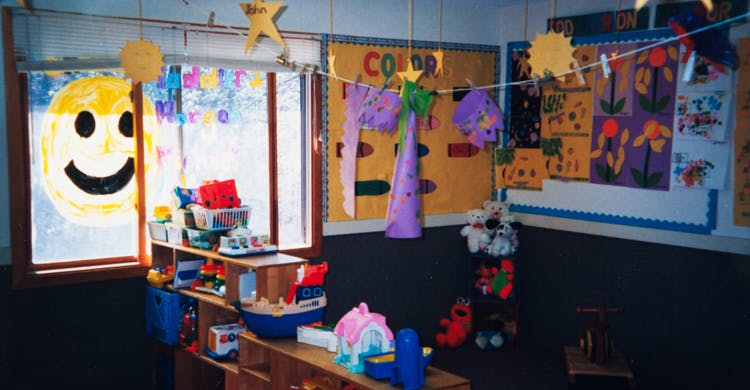 Classroom with children's artwork and toys