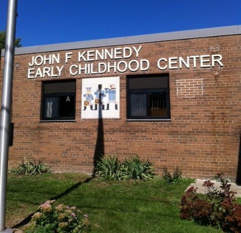 John F Kennedy Early Childhood Center sign on a brick building