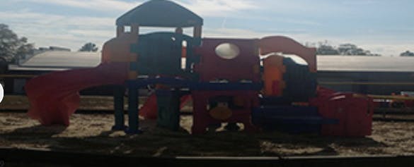 Playground structure with slides and climbing areas