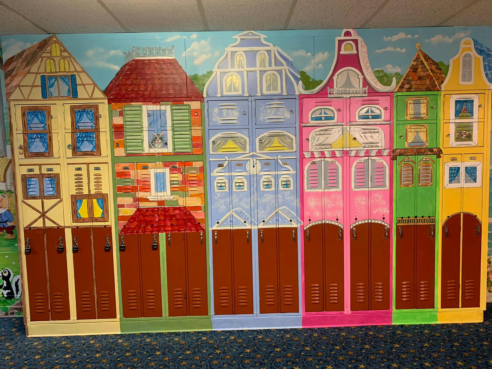 Wall mural of colorful buildings with windows and doors