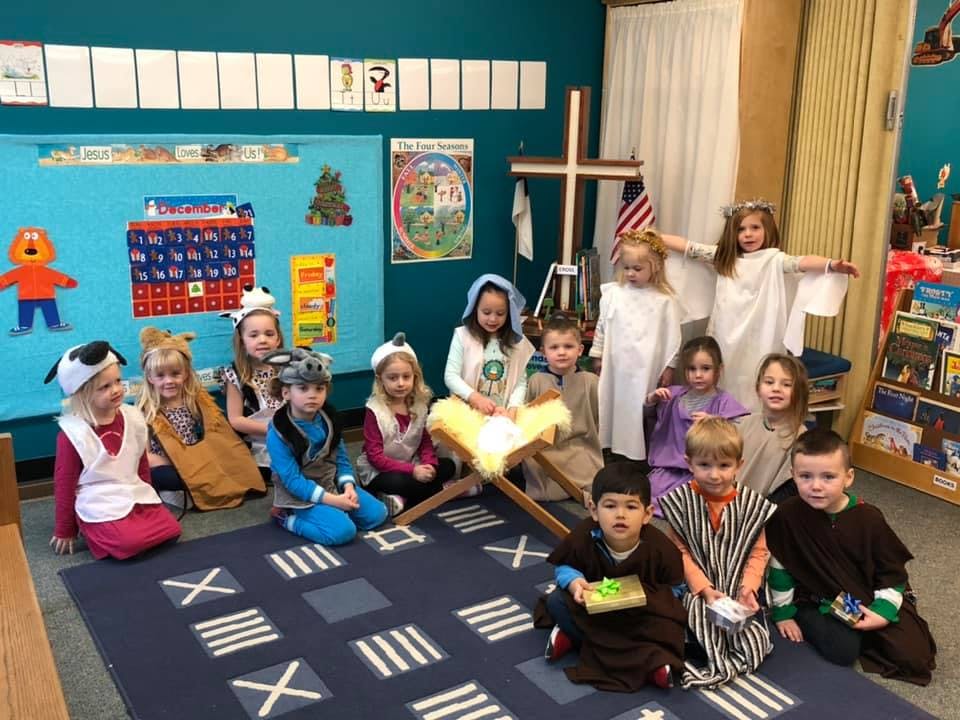Children in costumes performing a nativity play