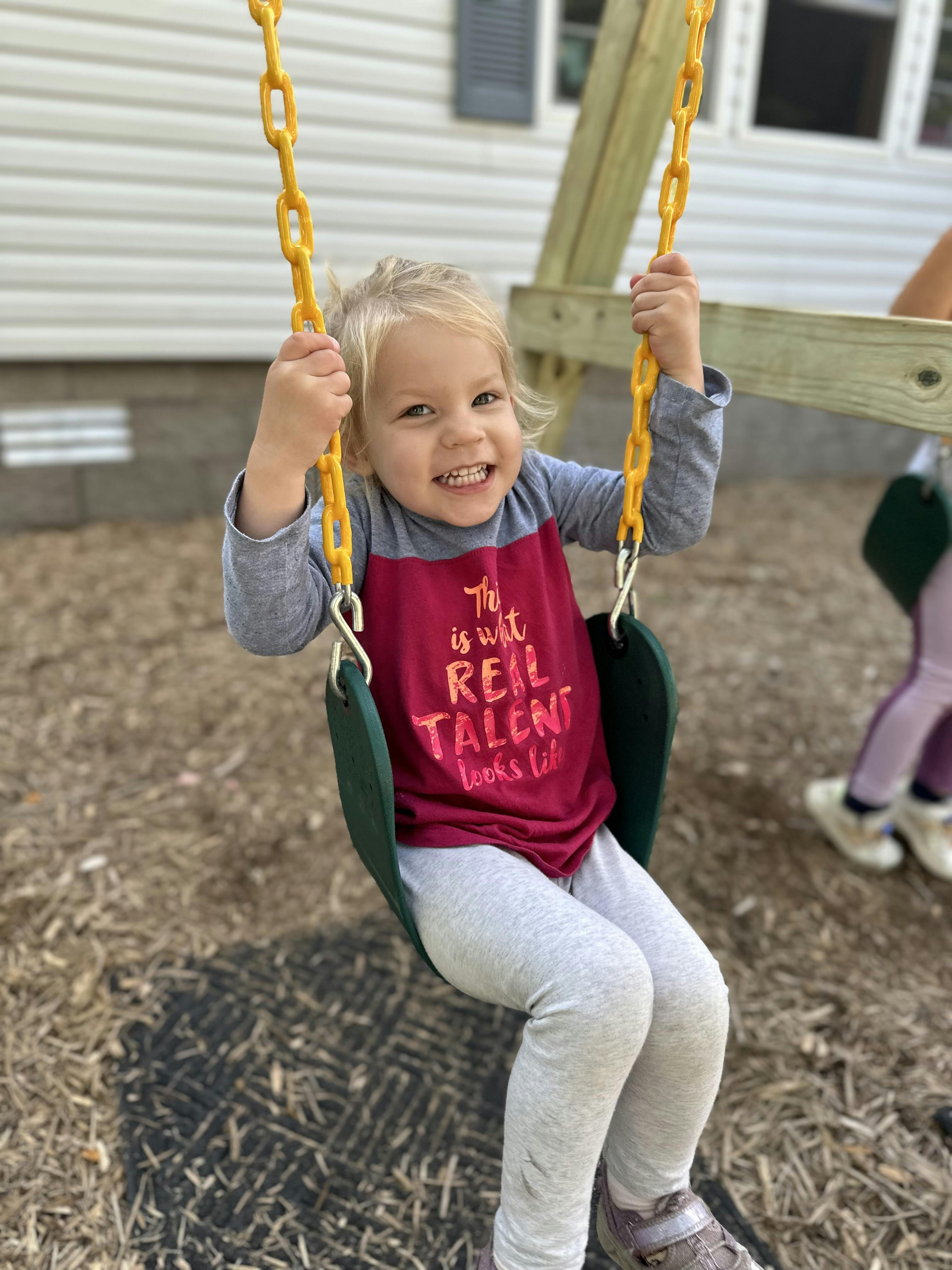 Child on a swing at a playground