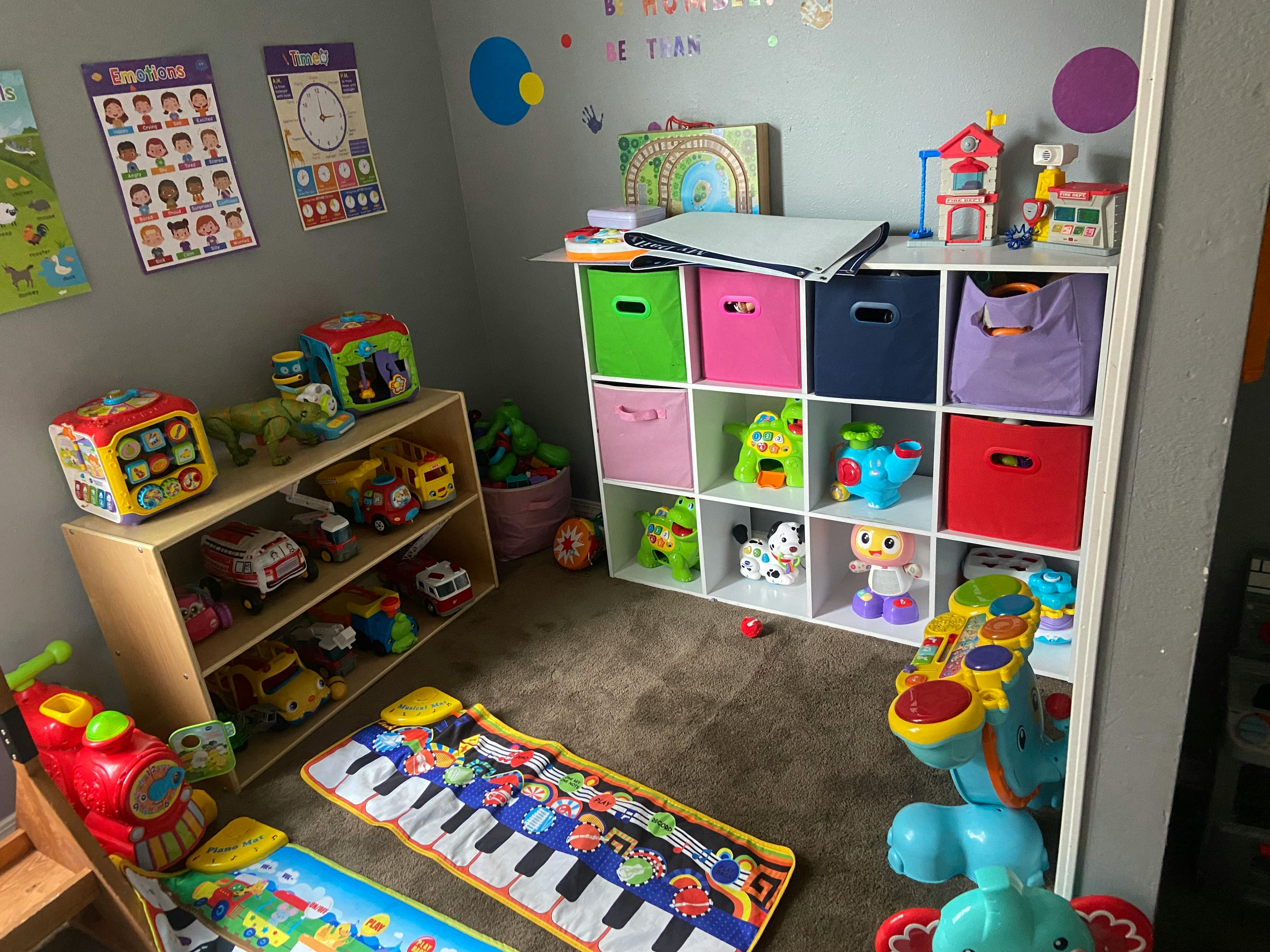 Playroom with shelves of toys and colorful storage bins