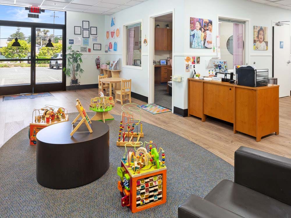 Lobby area with toys and a reception desk