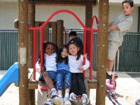 Children playing on a playground structure