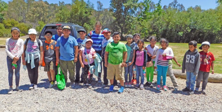Group of children and adults standing outdoors