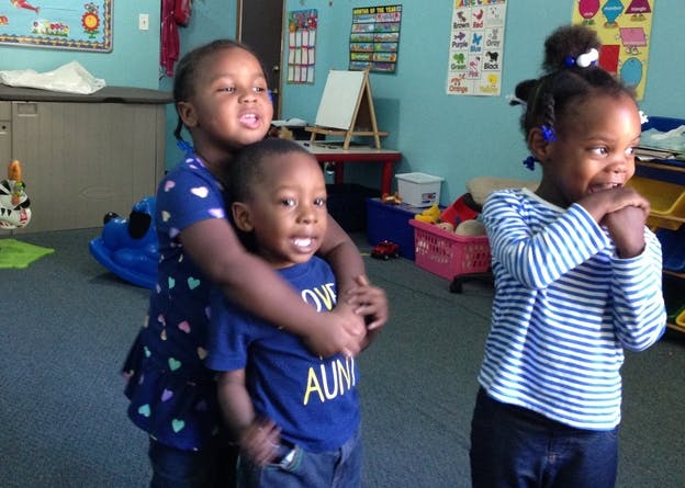 Three children in a classroom