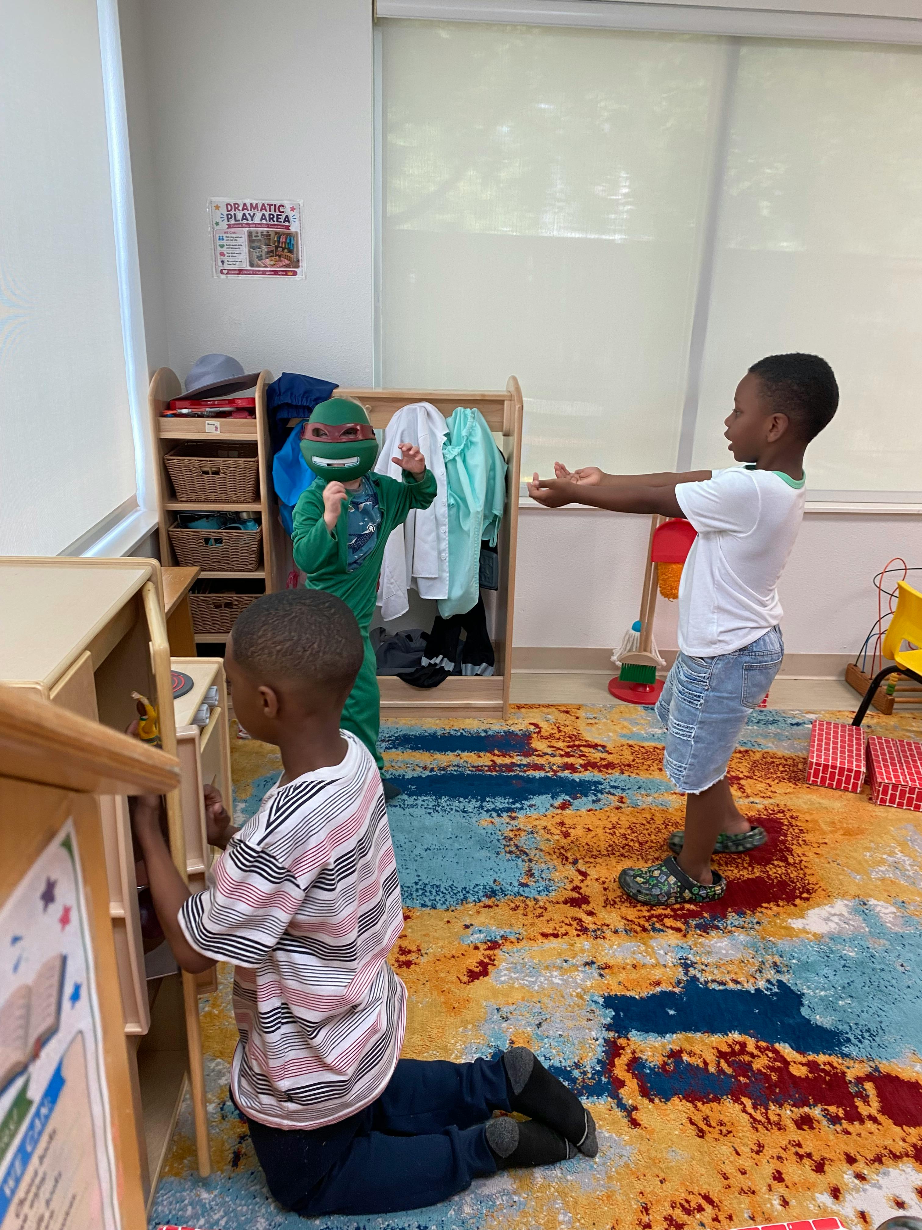 Children playing in a classroom dramatic play area
