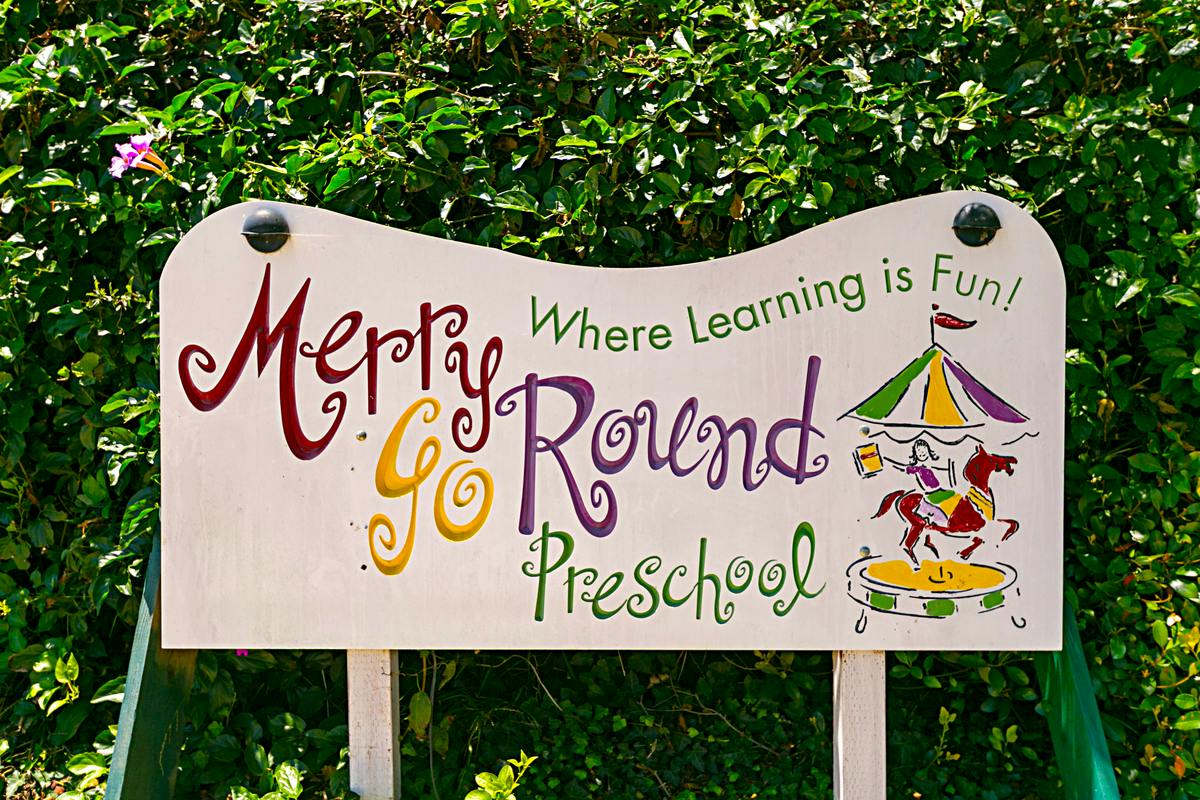 Merry Go Round Preschool sign with a carousel illustration