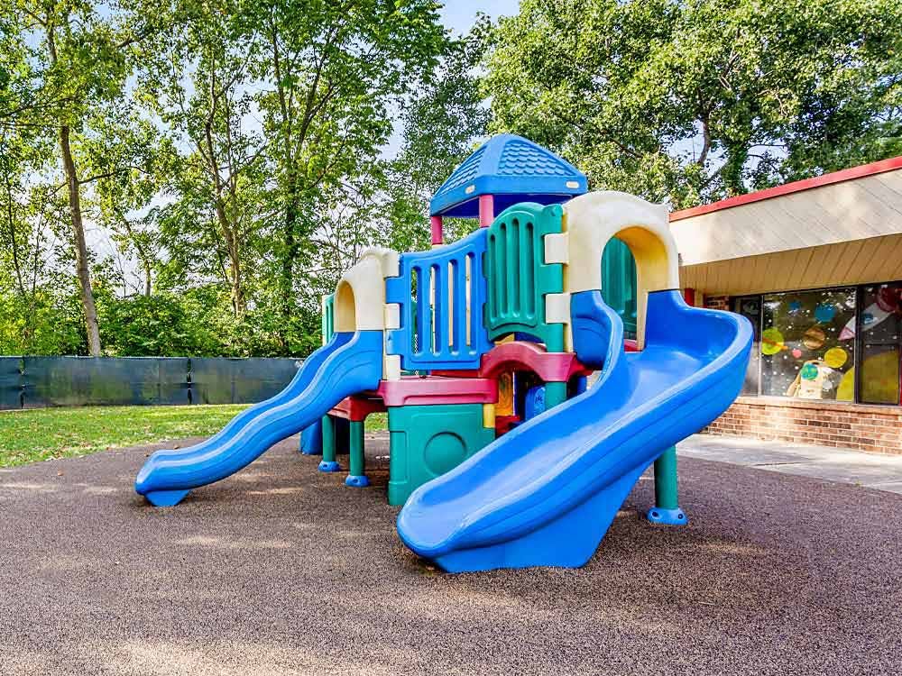 Colorful playground structure with two blue slides