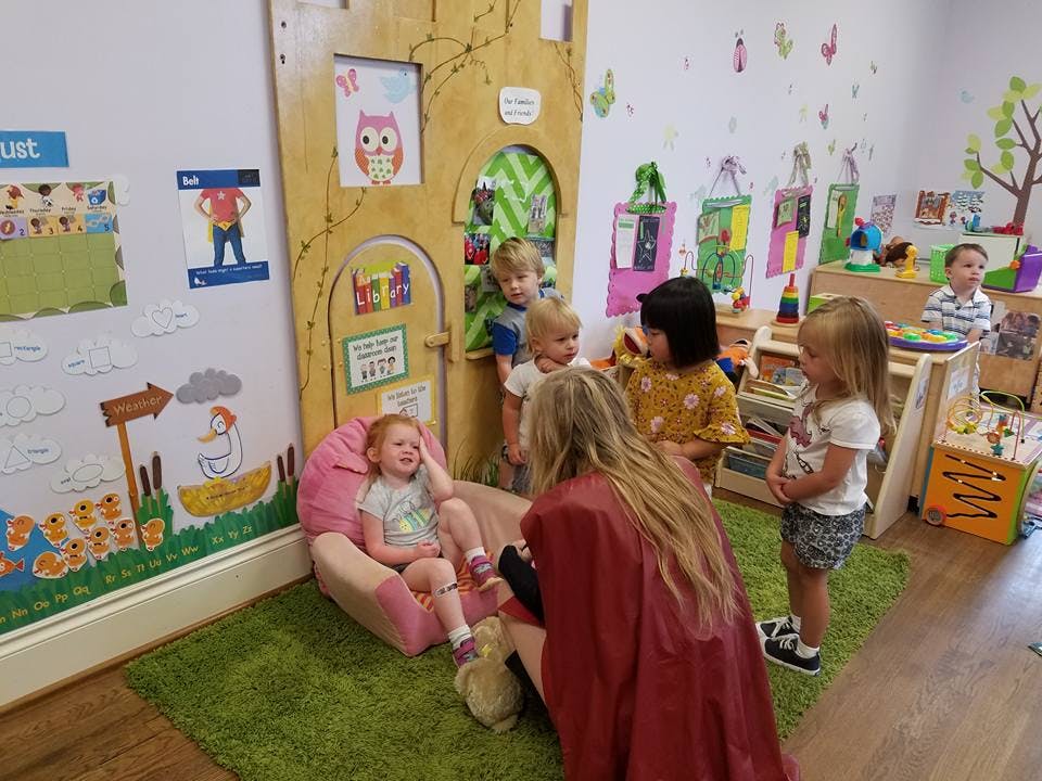 Adult and children in a classroom