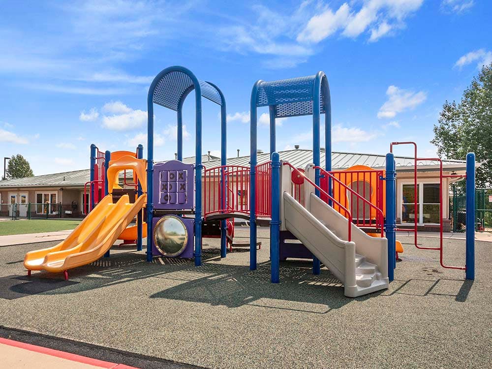 Colorful outdoor playground with slides and climbing structures