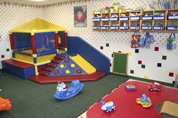 Indoor play area with soft play structure and toys