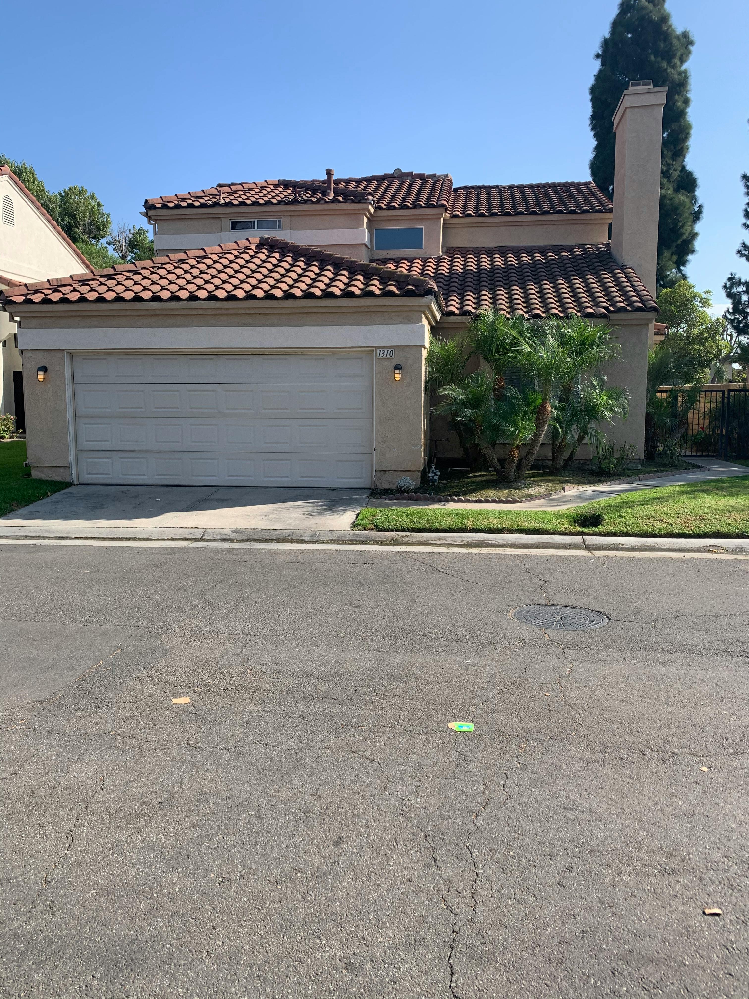 House with a garage and a tiled roof