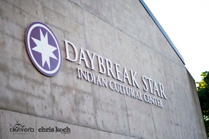 Daybreak Star Indian Cultural Center sign on a concrete wall