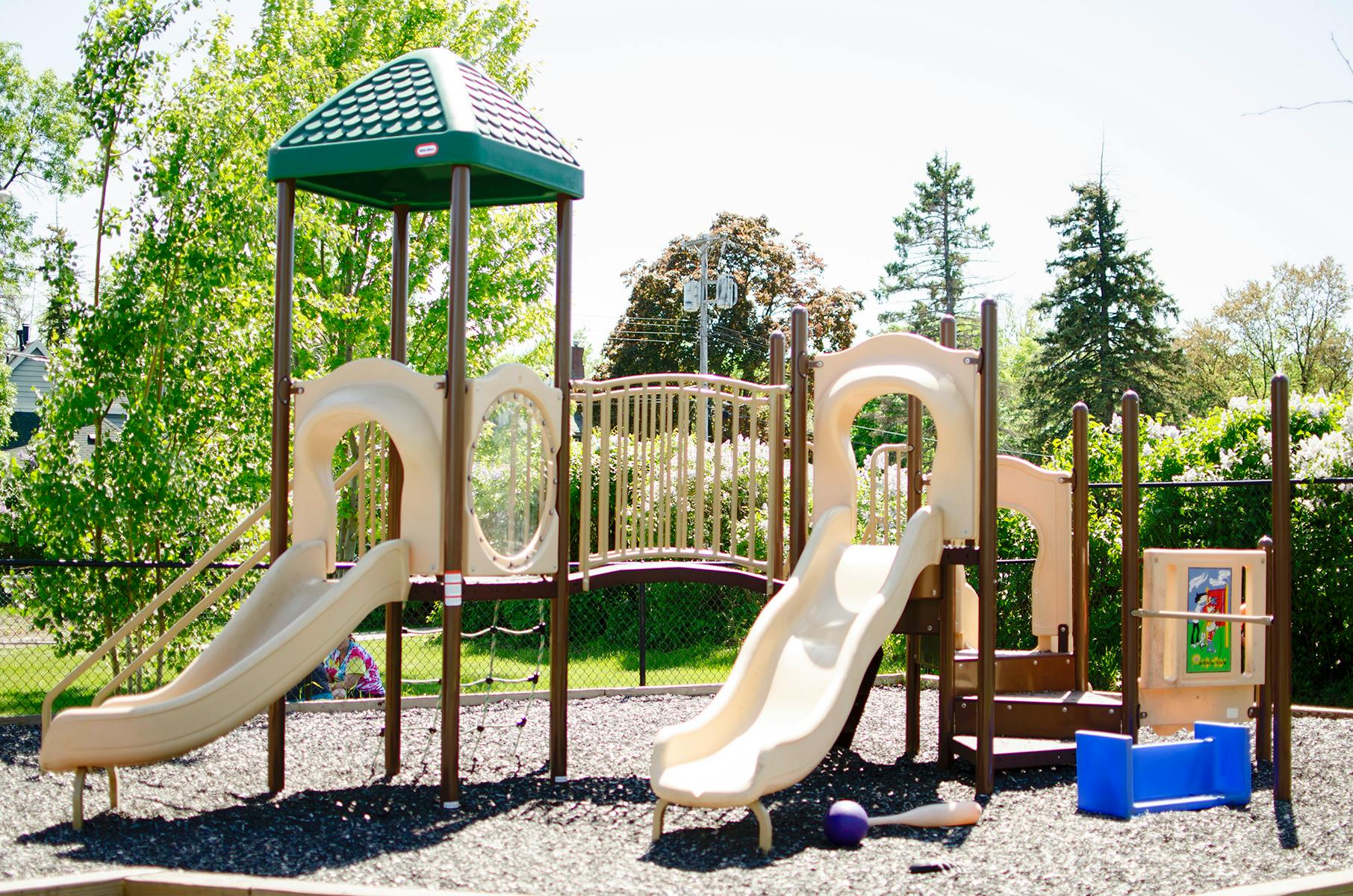 Playground structure with slides and climbing areas
