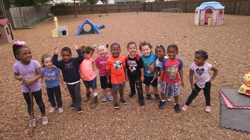 Group of children standing on a playground