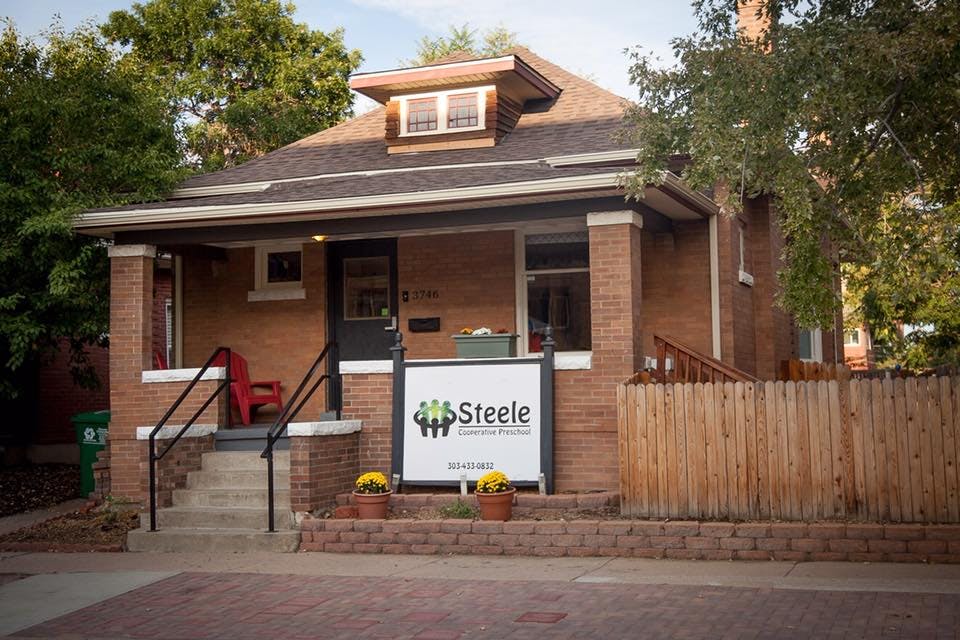 Brick house with a sign that reads "Steele"