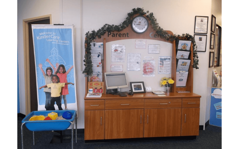 KinderCare banner next to a parent center desk