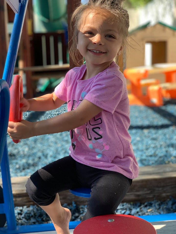 Child on a playground ride