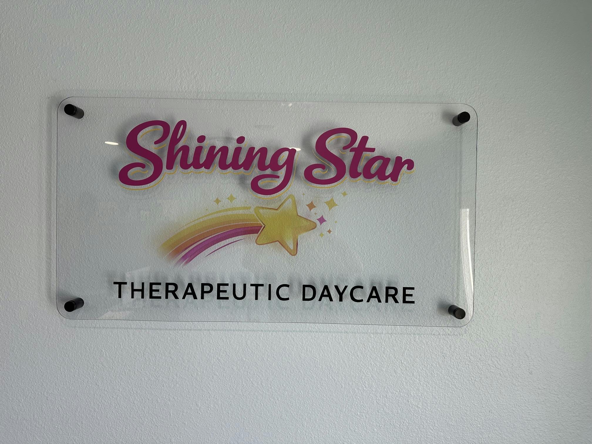 Sign for Shining Star Therapeutic Daycare with a shooting star graphic