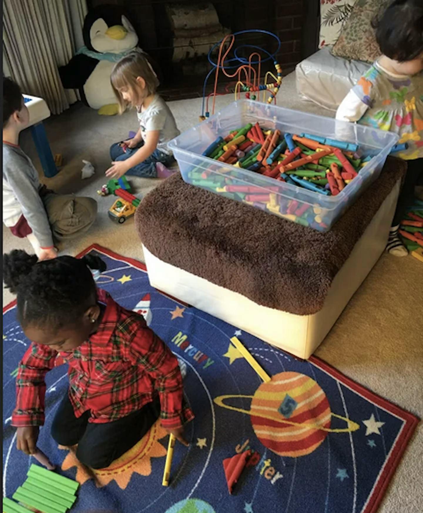 Children playing with toys on the floor