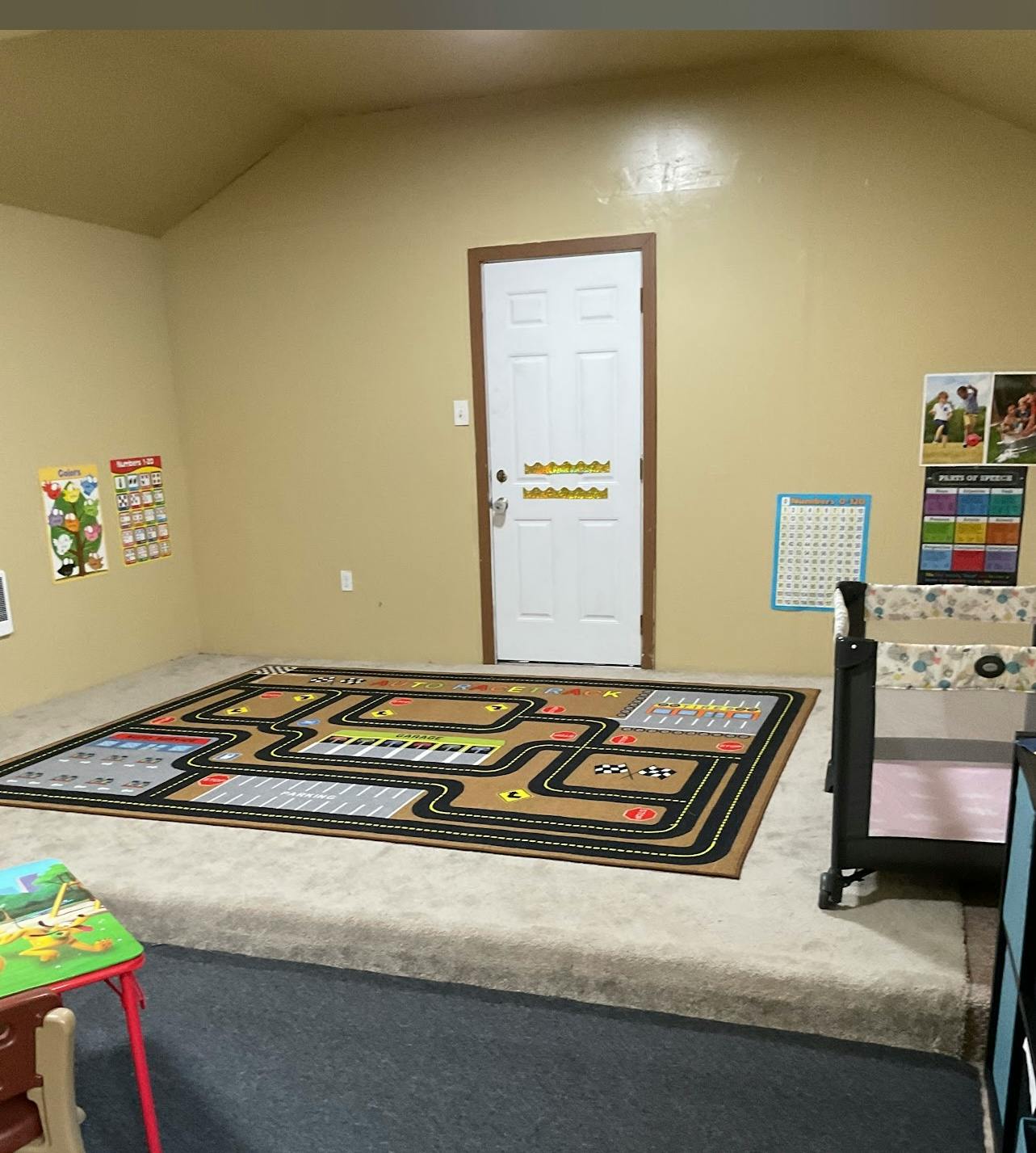 Playroom with a road map rug on a raised platform