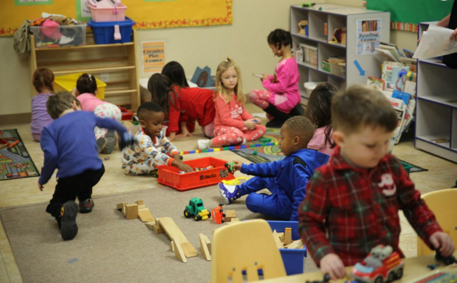 Children playing with toys in a classroom