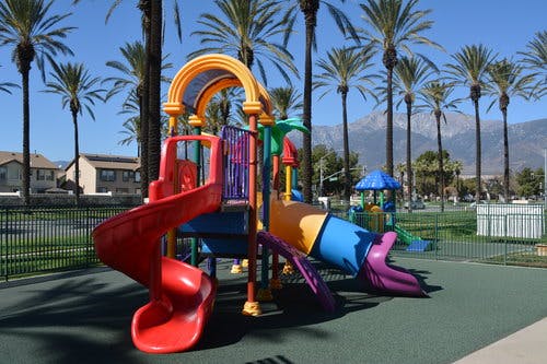 Colorful playground structure with slides and climbing areas