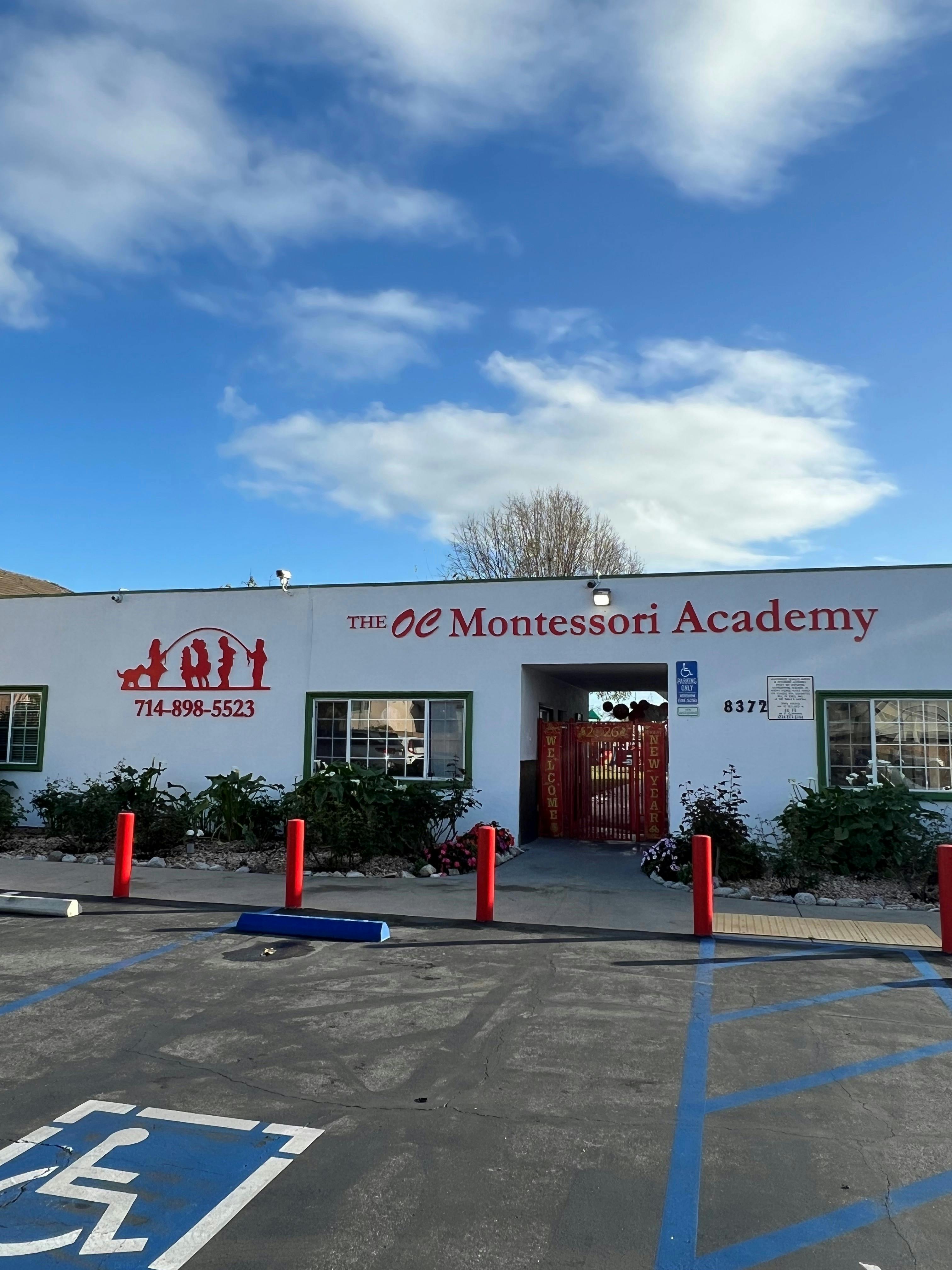 Exterior of The OC Montessori Academy with a parking lot in front