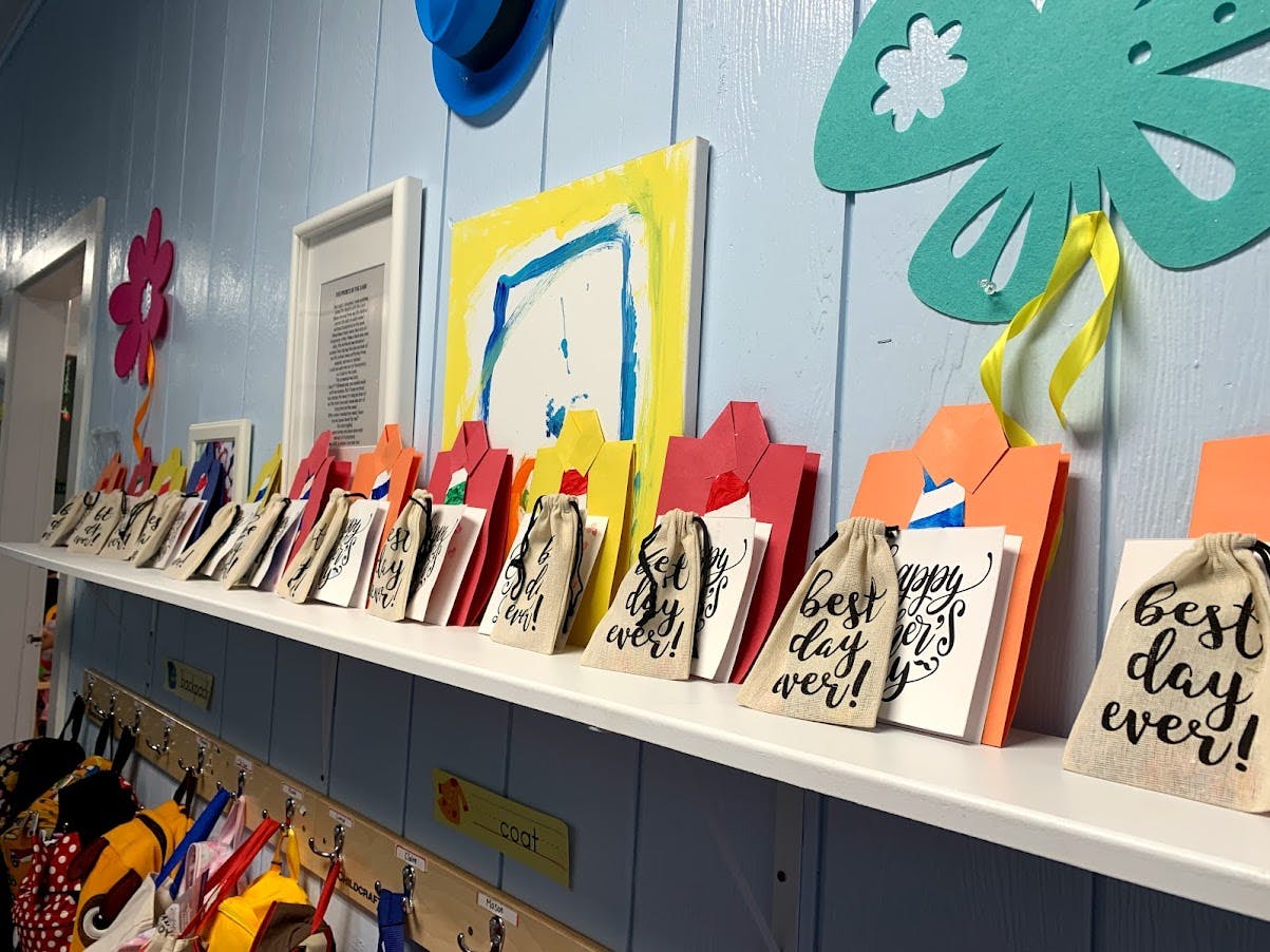 Shelf with small bags and cards, some bags say "best day ever!"