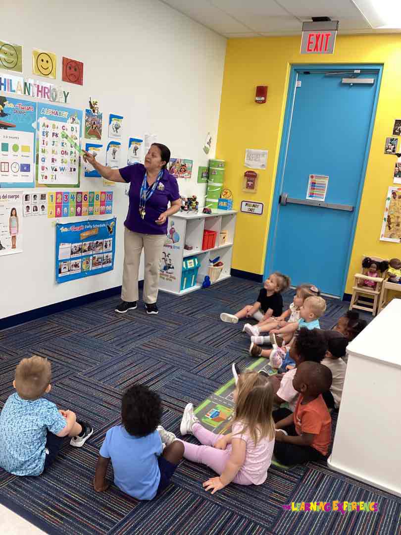 Person teaching children in a classroom