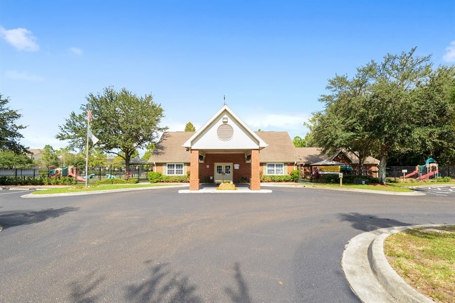 Building with a gabled entrance and a paved driveway