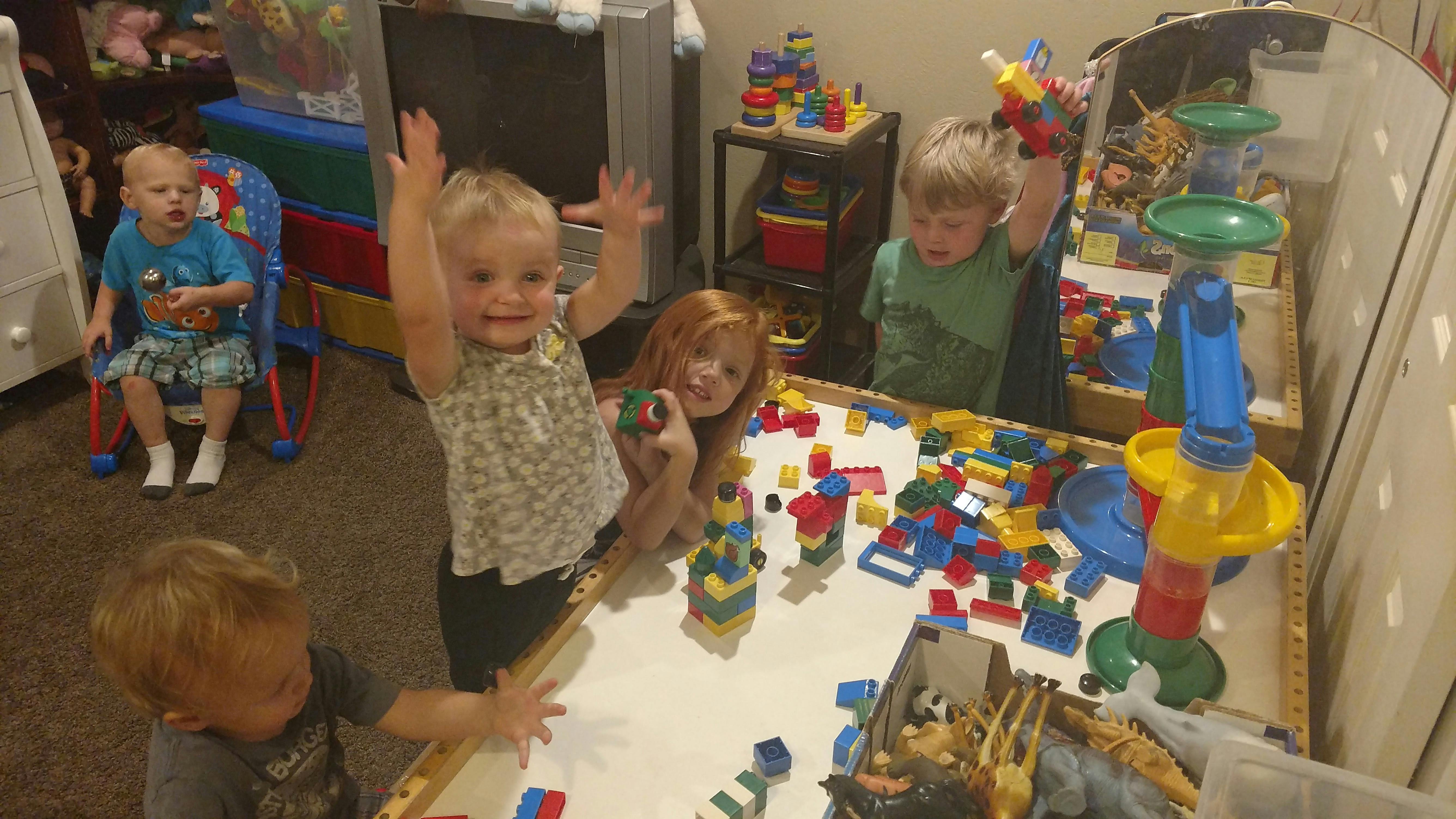 Children playing with building blocks and toys