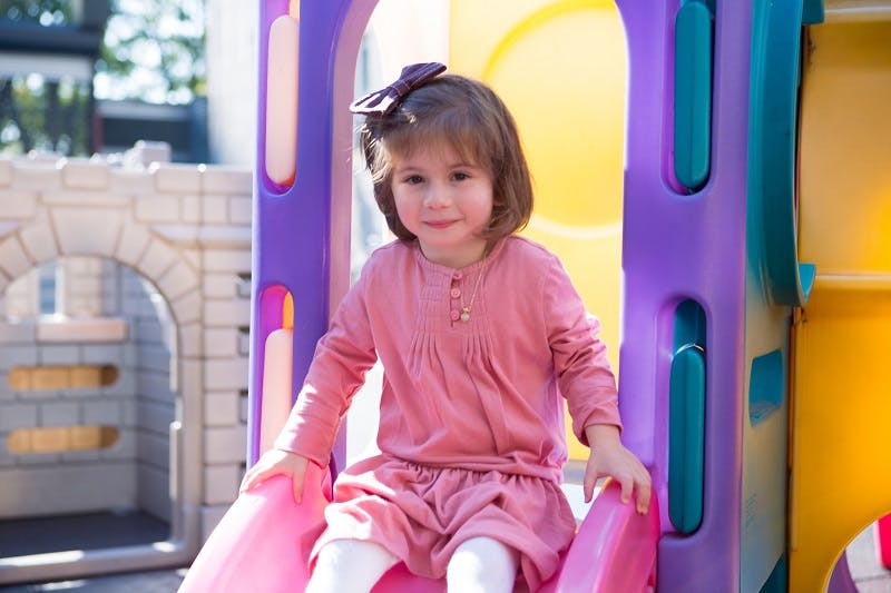 Child on a playground slide