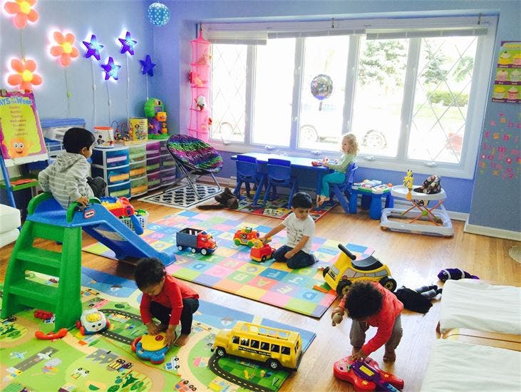 Children playing with toys in a brightly lit room