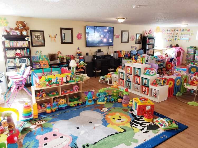 Playroom filled with toys and a colorful rug