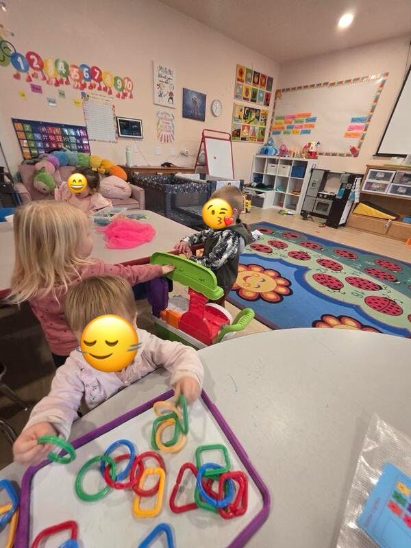 Children playing with toys in a classroom