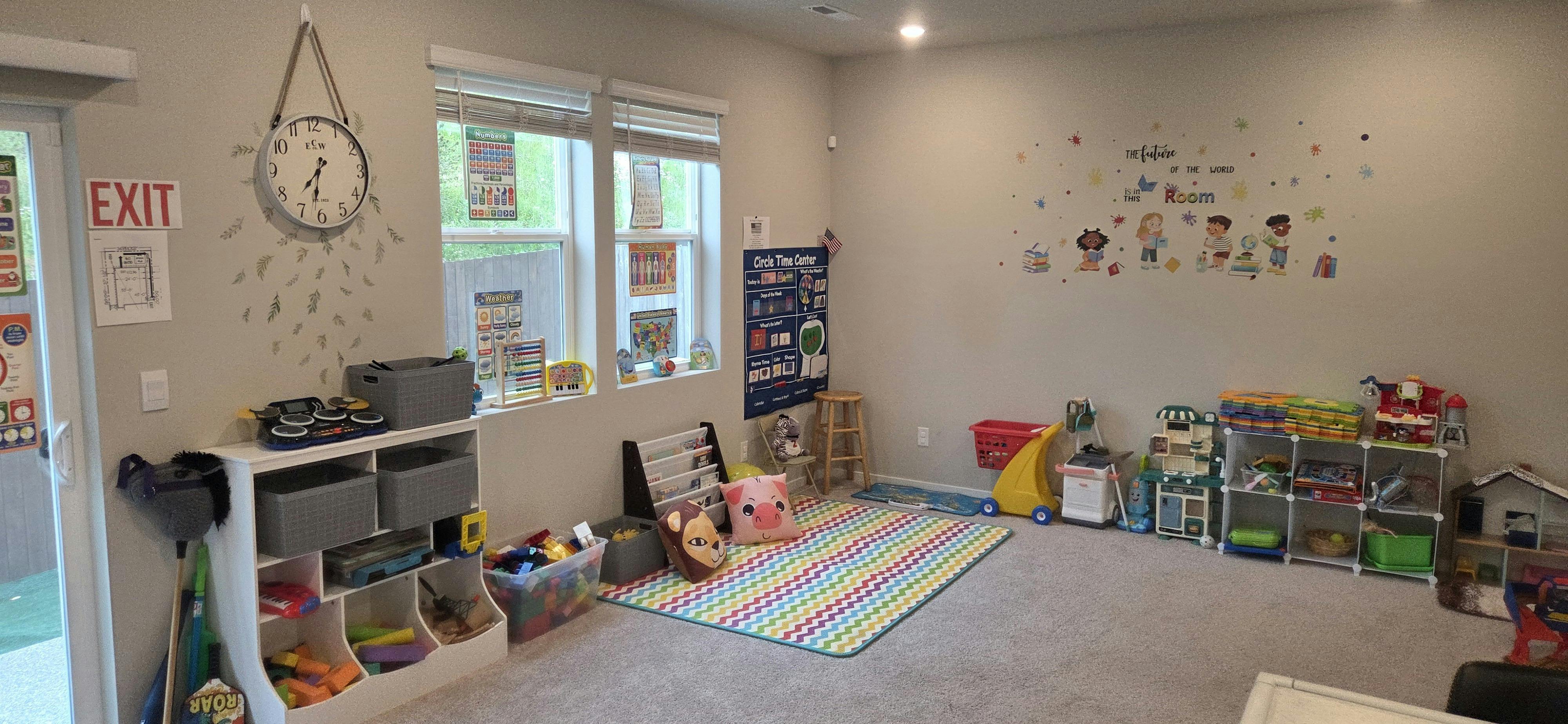 Playroom with toys, storage, and a colorful rug