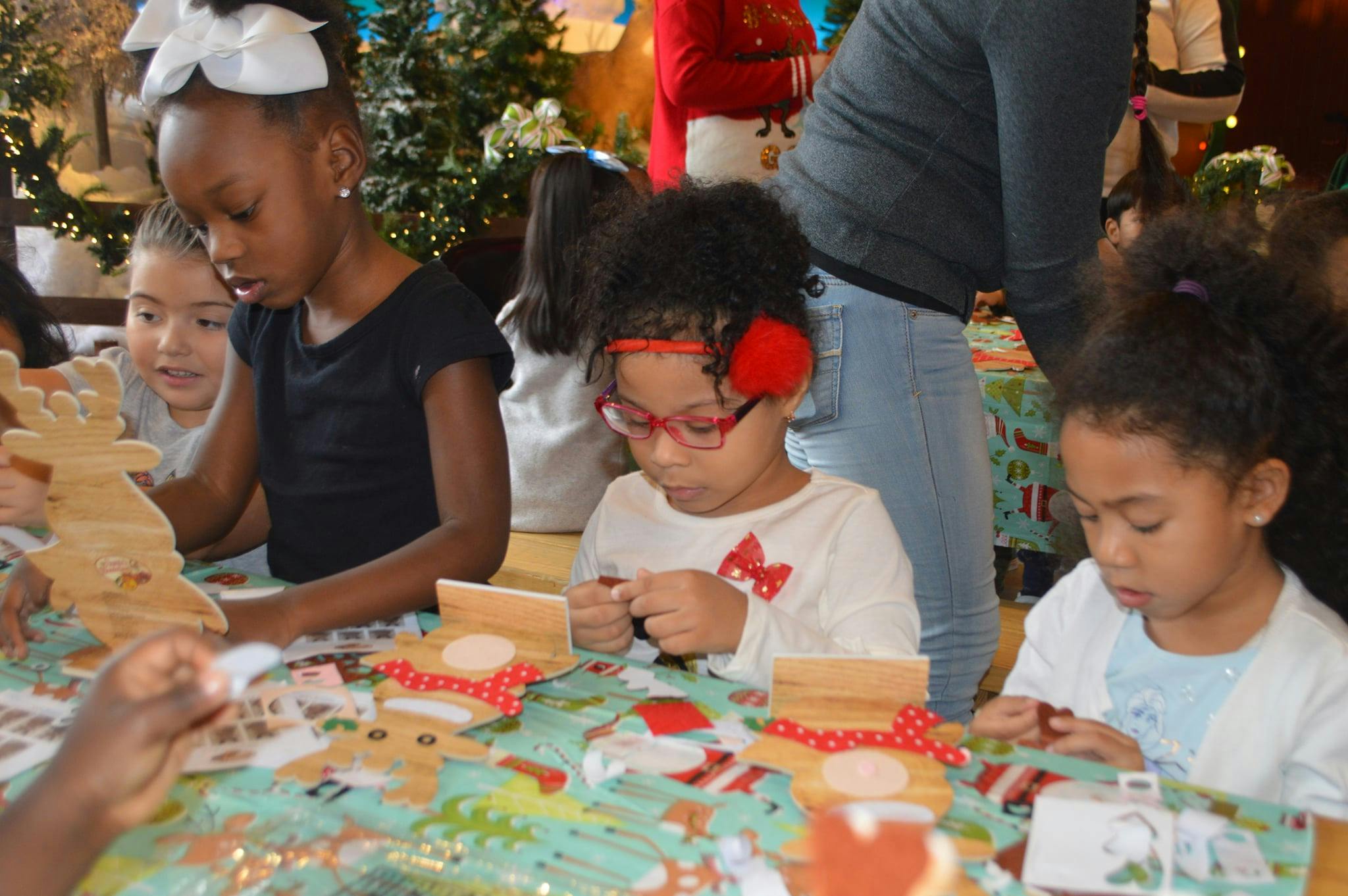 Children making crafts at a table