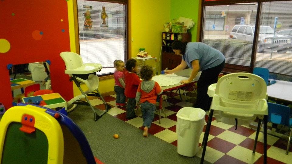 Adult and children in a classroom