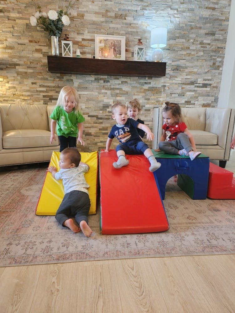Children playing on soft play equipment