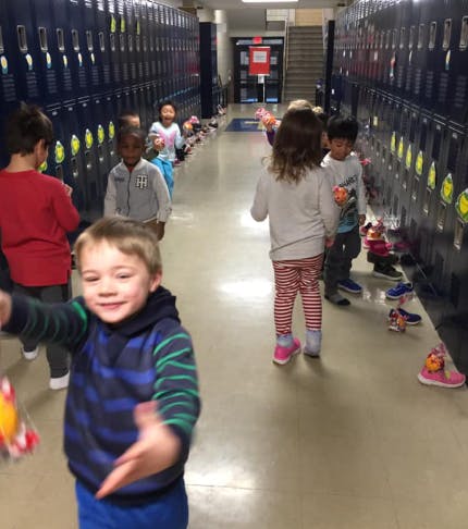 Children in a hallway with lockers